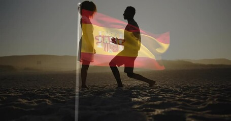 man walking on dune at sunset and kneeling opening box for wedding proposal under Spanish flag - Powered by Adobe