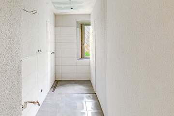 renovated bathroom with window without sanitary objects