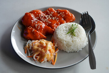 Chicken Katsu with Mentai, Indonesia, captured on June 16, 2025. Crispy breaded chicken cutlet topped with creamy mentaiko sauce, combining Japanese and local flavors in a savory fusion dish.