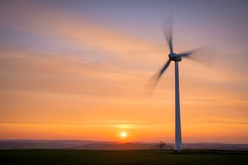 Renewable wind energy turbines generate clean electricity against a picturesque sunset sky