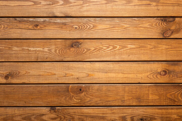 Rustic brown wooden planks texture with natural grain and horizontal arrangement