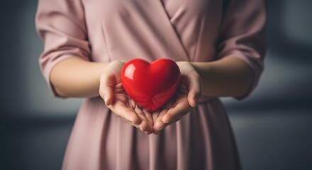 Woman Holding a Red Heart Symbol of Love, Care, and Compassion