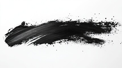 Black paint brush stroke with splatters on white background