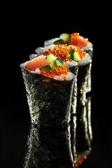 Delicious Sushi Rolls with Fresh Ingredients on Black Background