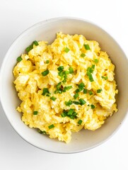Creamy Scrambled Eggs with Chopped Green Onions in White Bowl