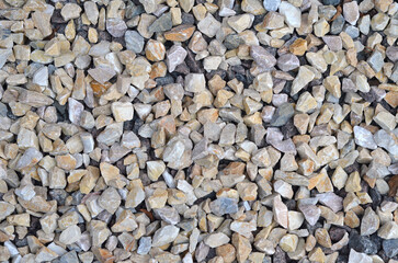  Rubble or gravel stone background in grey and beige colors construction or decorative material.Closeup, top view .