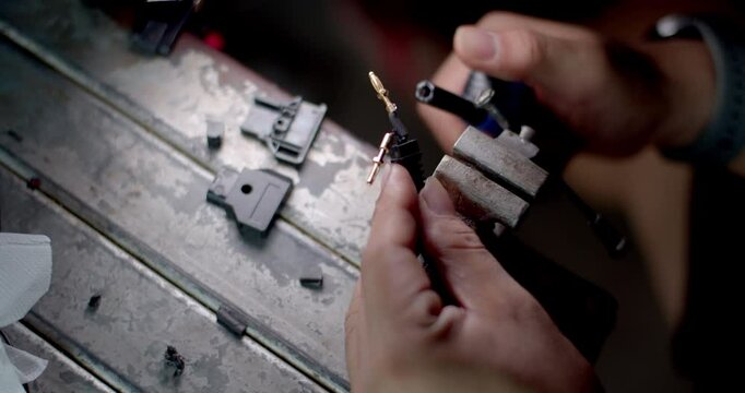 Insert shrink tubing and heat it with a lighter to fit the tubing over the wires and protect them.Clear shrink tubing to prevent internal short circuit.