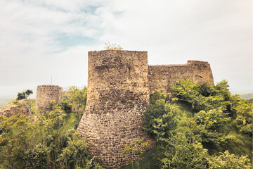 Aerial view Manavi Fortress Complex. A Medieval Royal Stronghold. Strategic Hilltop Citadel Overlooking Iori Valley in Kakheti, Georgia. Hidden gem sightseeing off the beaten path attraction