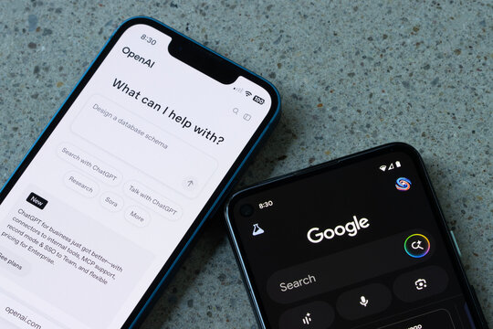 Portland, OR, USA - June 11, 2025: Website homepage of OpenAI and homepage of the Google app with the new AI Mode button are seen respectively on an iPhone and a Google Pixel smartphone.