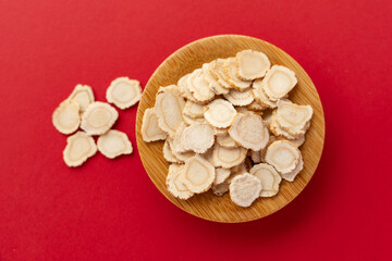 American ginseng, a traditional Chinese medicine, on a red background