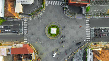 Aerial View of a City Intersection with Central Roundabout and Surrounding Buildings