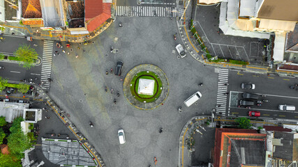 Aerial View of a City Intersection with Roundabout and Traffic, Urban Landscape Photography