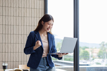 Successful Happy caucasian young woman student freelancer using laptop, watching webinars, working...
