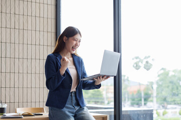 Successful Happy caucasian young woman student freelancer using laptop, watching webinars, working...