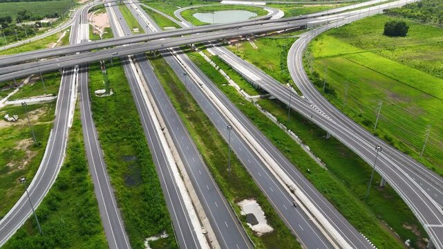 Aerial view drone footage of a complex bridge intersection where multiple highway numbers 290 and 304 Nakhon Ratchasima