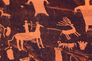 Petroglyph on Newspaper Rock in Utah depicting hunting on horseback