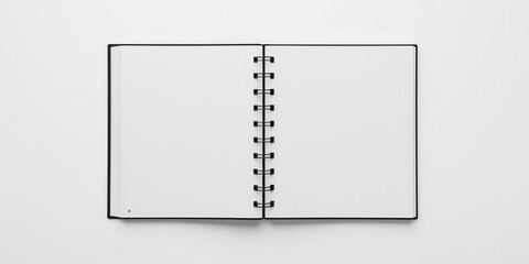 Blank spiral bound notebook open on a white surface with minimalist aesthetic inviting creativity and focus