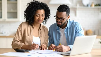 Couple working together on financial documents - Powered by Adobe