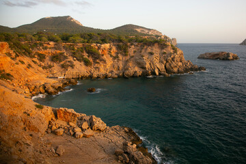 Wonderful cliffs overlooking the wild beach of Cala Sardina on the island of Ibiza.