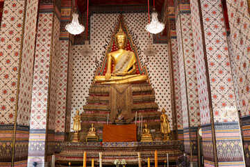 Golden Buddha Statue is in a temple.