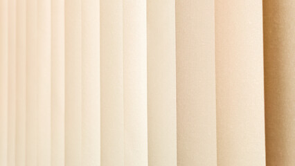 Vertical Lines Cream Texture: A close-up shot reveals a captivating texture of vertical lines in creamy beige hues, creating a smooth and elegant visual effect.