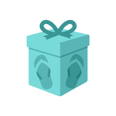 A beautifully wrapped turquoise gift box with decorative ribbons on a festive table