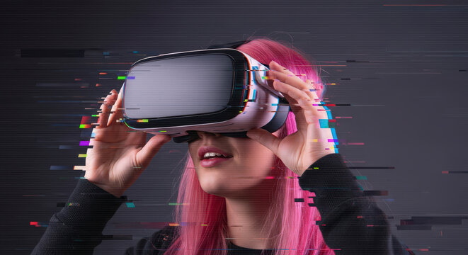 Young Woman with Pink Hair Experiencing Virtual Reality with a White Vr Headset and Glitch Effect in Dark Studio