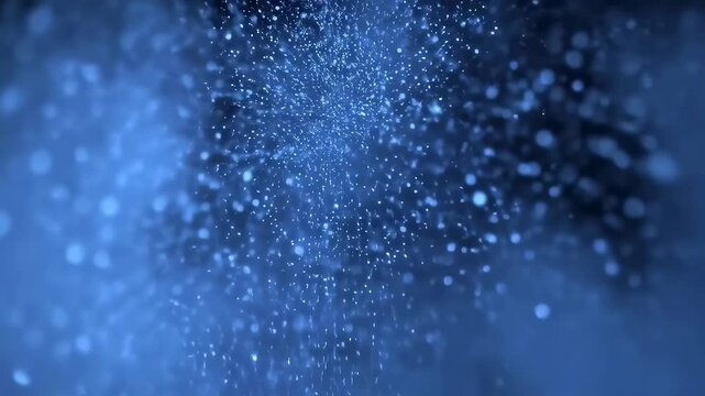 Seamless looping blue powder explosion on black background
