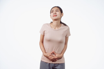 A confident young Asian woman in a light brown shirt stands against a white background,...