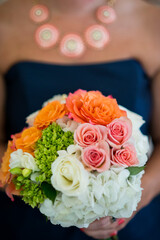 Bridesmaid in Navy Dress Holding Bright Mixed Bouquet