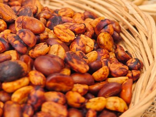 Roasted coffee beans in basket.
