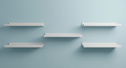 Five minimalist white shelves mounted on a light blue wall, creating a clean and simple display