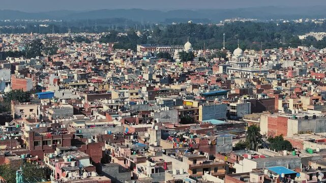 Aerial view of an Indian City and agricultural fields near the Delhi-Chandigarh Highway in Punjab, India. Natural texture for the background. The picturesque countryside of India. Healthy food concept