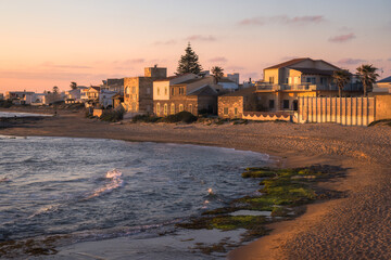Stunning Sunset Paints Punta Secca's Shore in Vibrant Hues of Sicily's Coastline, Italy