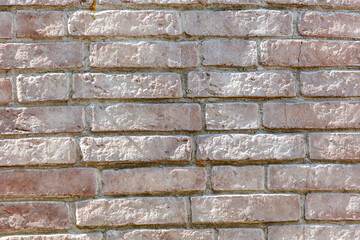 A brick wall with a white border