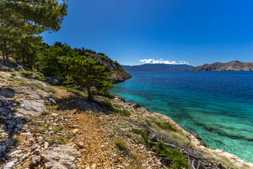 Fototapeta premium Jablanova Beach on the island of KRK in Croatia, blue trail leading to an empty pebble beach,