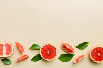 fresh Fruit grapefruit with Juicy grapefruit slices on colored background. Top view. Copy Space. creative summer concept. Half of citrus in minimal flat lay with copy space
