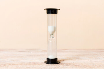 hourglass on the table, sand clock as time passing concept for business deadline, copy space