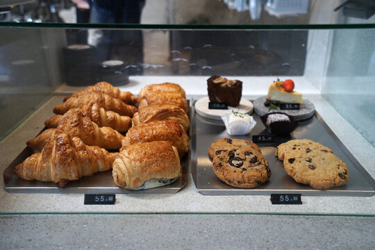 Assorted Bakery pastry display box- butter croissant, brownie, savoury pie, green tea cake, raisin muffin and chocolate chips cookies