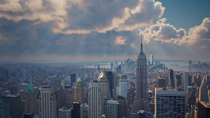 Manhattan skyline emerging from clouds - Powered by Adobe