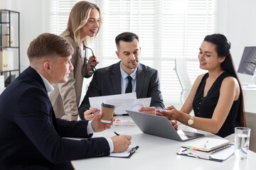 Marketing. Team of businesspeople working together at desk in office