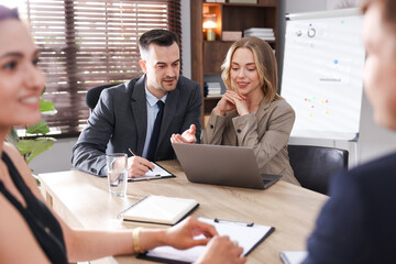 Marketing. Team of businesspeople working together at desk in office