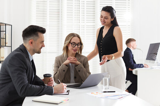 Marketing. Team of businesspeople working together at desk in office