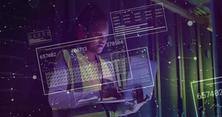 Data center technician typing laptop and displaying data panels while monitoring metrics - Powered by Adobe