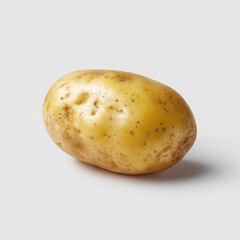 Single potato, light yellow, slightly mottled skin, on white background