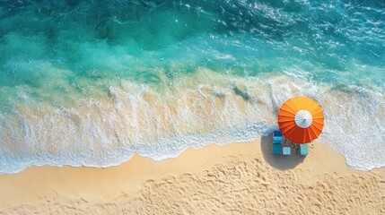 Obraz premium aerial view of the tranquil seashore meeting the beach displaying sun umbrella and chairs capturing relaxation and summer vibes on tropical beach getaway with turquoise waves
