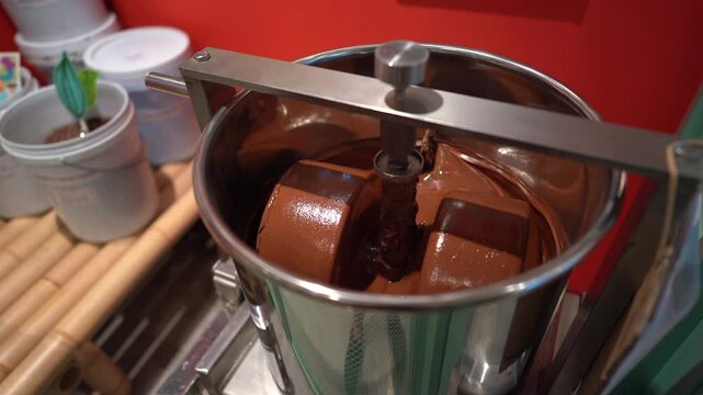 Chocolate mixing container in conching machine for smooth production, Stainless steel vessel blending cocoa in chocolate manufacturing process