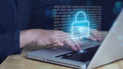 Hacker working on a code on dark digital background with digital interface around.Internet crime concept.