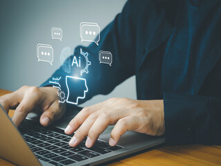 An artificial intelligence concept with human hands typing on laptop keyboard and digital icons floating above, symbolizing ai technology and communication innovation