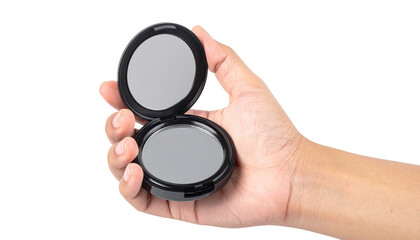 Hand gripping sleek black compact mirror, revealing pristine reflection, against transparent backdrop